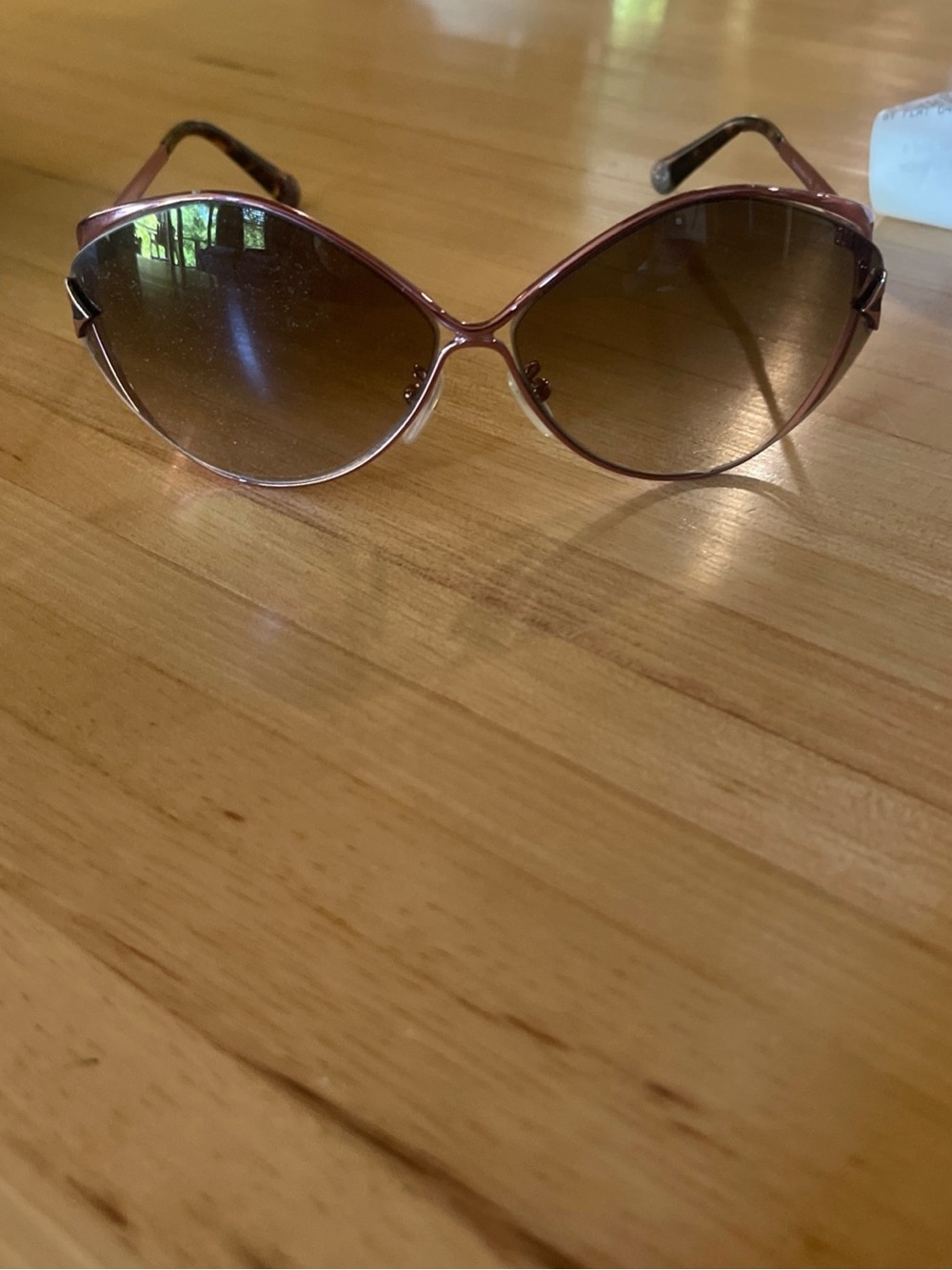 Louis Vuitton Laurel Rose-Tone Frame Sunglasses with Brown Gradient Lenses.